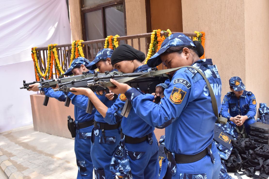 Members of India's first all-woman SWAT team pose for photos ahead of their first deployment. 