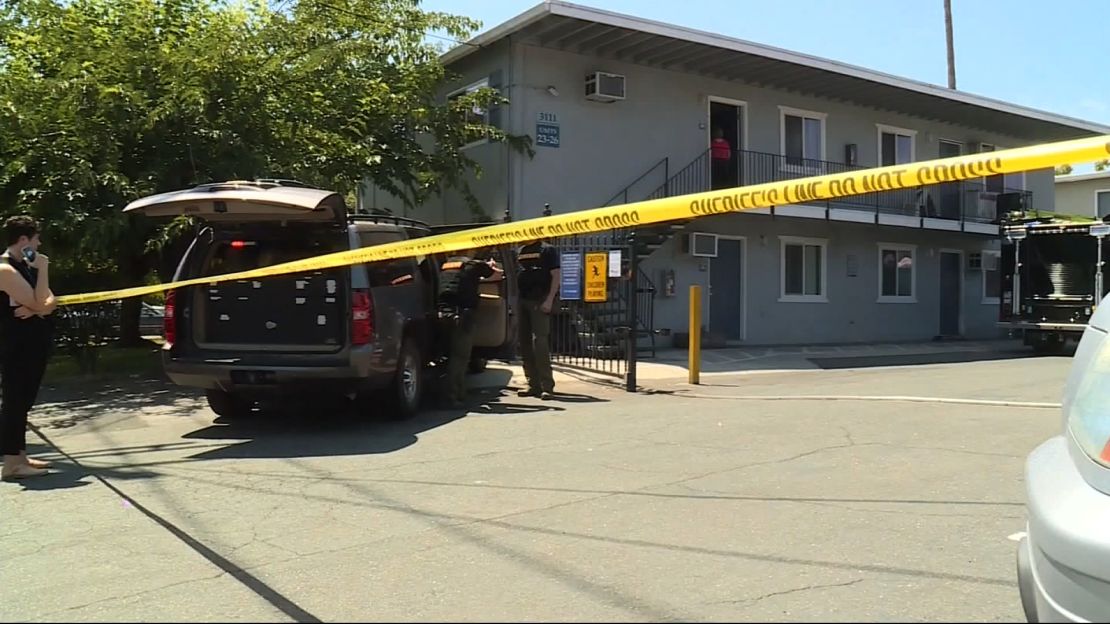 Officials from multiple state and federal law enforcement agencies gather evidence from a Sacramento, California,  apartment complex where Ameen was taken into custody on Wednesday.