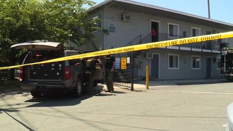 Officials from multiple state and federal law enforcement agencies gather evidence from a Sacramento, California, apartment complex where Ameen was taken into custody on Wednesday.