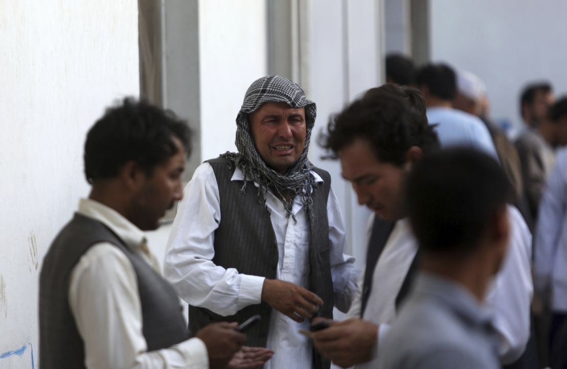 Afghans mourn a victim of the deadly suicide bombing.