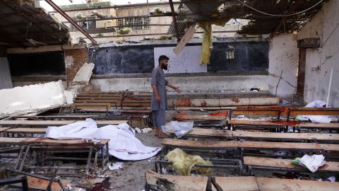 A man inspects the scene of a suicide bomb attack in Kabul, Afghanistan, on Wednesday.