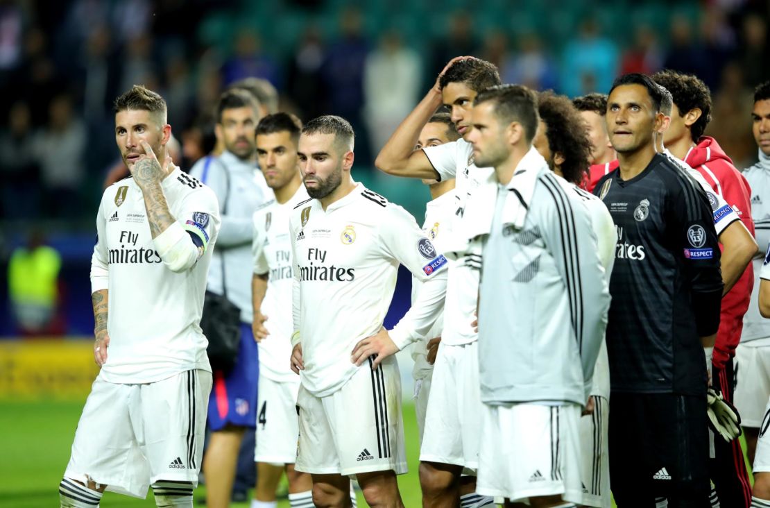 Real captain Sergio Ramos and teammates look dejected following defeat.