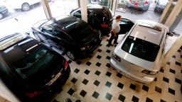 An Iranian man looks at cars displayed in a showroom in the capital Tehran on August 6, 2018. - Iran dismissed a US offer to renegotiate a historic 2015 nuclear deal signed with other major powers as President Donald Trump reimposed crippling sanctions on August 7. (Photo by ATTA KENARE / AFP)        (Photo credit should read ATTA KENARE/AFP/Getty Images)