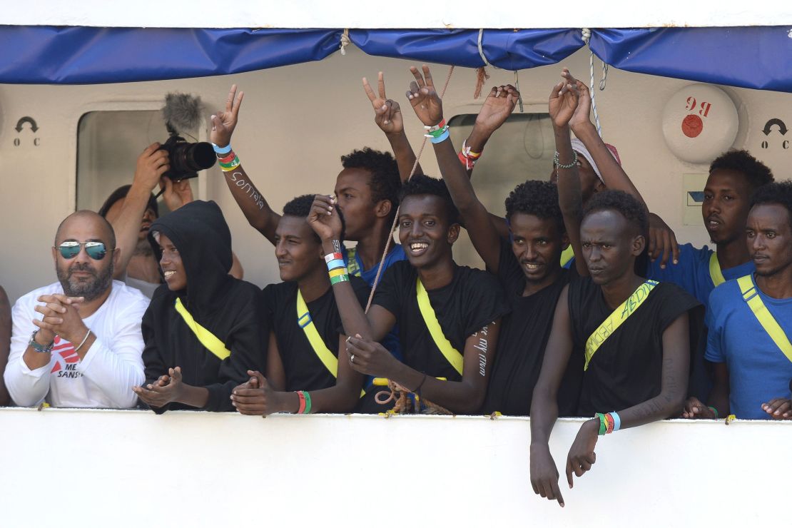 Migrants cheering on the Aquarius rescue ship as it arrived in Senglea, Malta, on August 15, 2018.