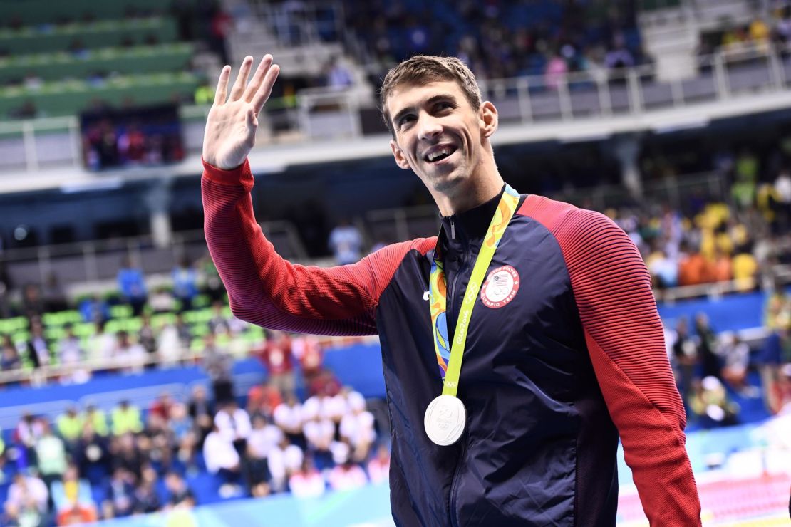 Michael Phelps waves during the medal ceremony of the Men's 100m Butterfly Final at the Rio 2016 Olympic Games.