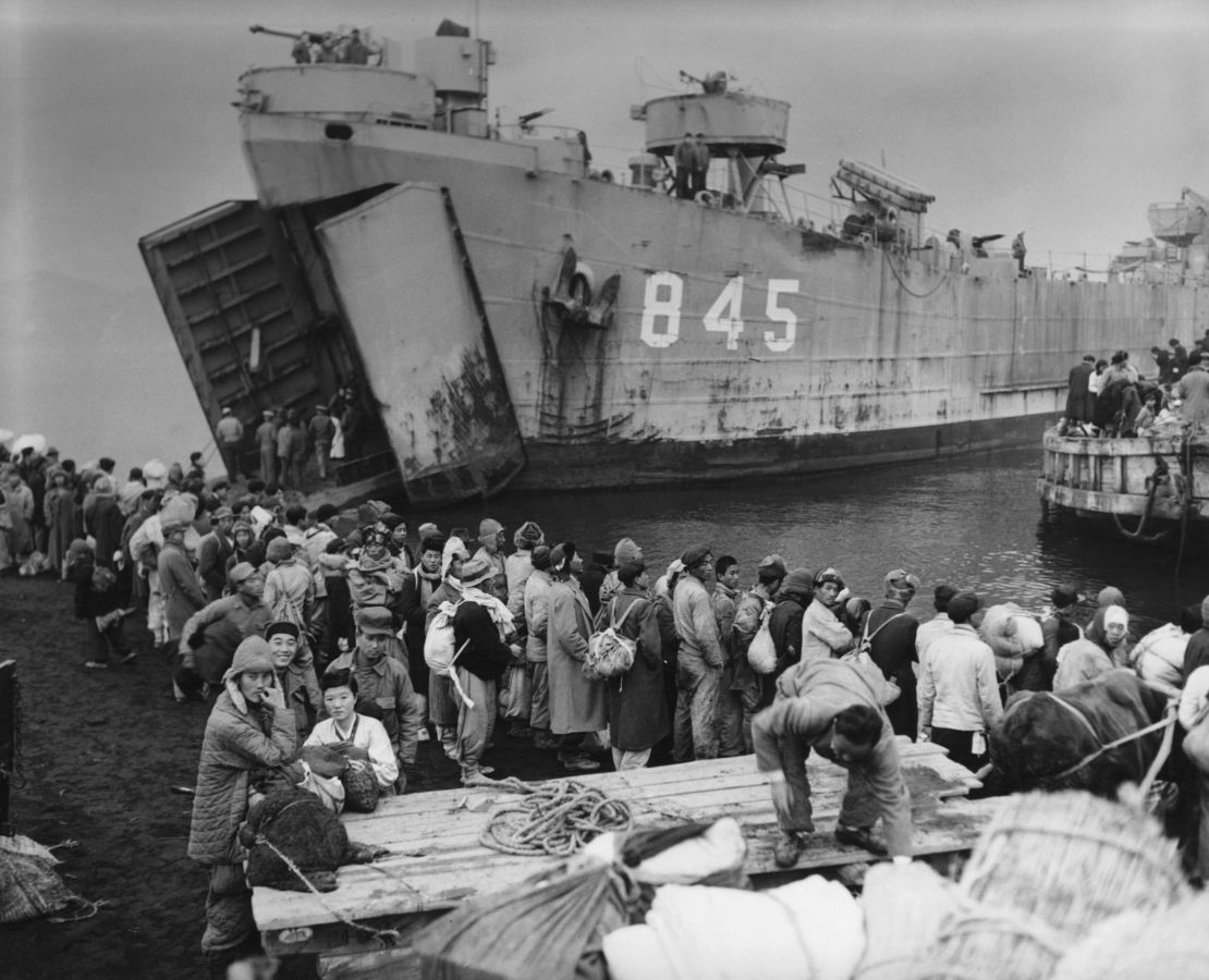 Civilians from Hungnam in North Korea board the landing ship USS Jefferson County as they flee their city during the Korean War on December 19, 1950.