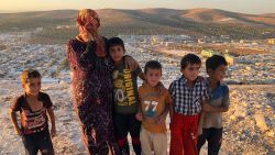 Vaciha Turki Al Omar, 30, has been in Idlib for seven months. She on the hill overlooking the sprawling refugee camp with her kids. 