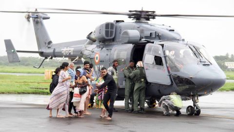 The Indian Navy sends divers with boats and relief items to flood-affected areas.