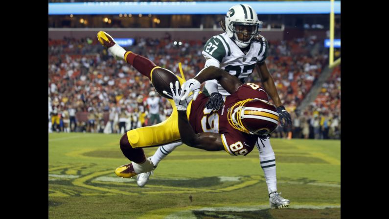 Darryl Roberts of the New York Jets breaks up a pass intended for Cam Sims of the Washington Redskins during the first half of a preseason NFL game on Thursday, August 16, in Landover, Maryland.
