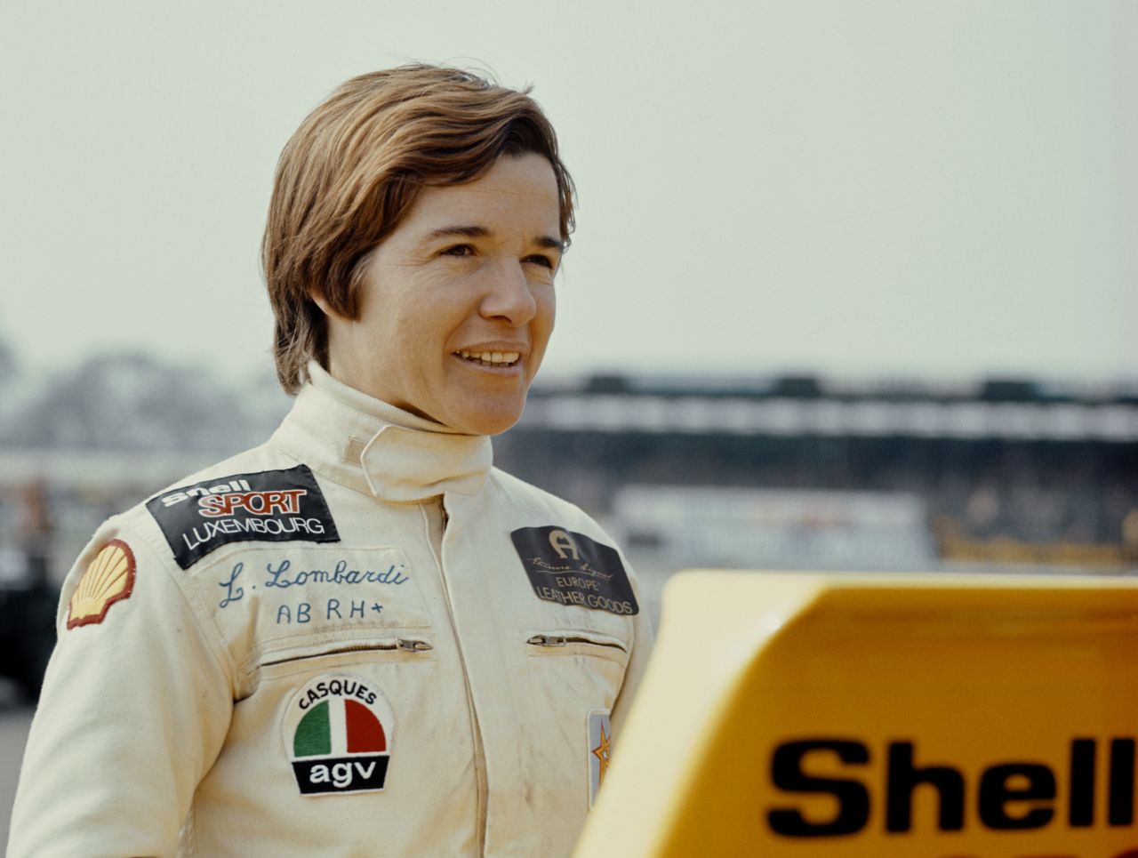 In 1975, Lella Lombardi became the first and only female driver to earn points in a grand prix. She finished sixth and scored a point at the Spanish Grand Prix, but the race was halted after 29 laps due to a major crash and drivers were awarded half points.