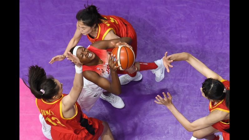 Japan's Stephanie Mawuli shoots as China's Han Xu, right, tries to block her in a basketball game during the Asian Games in Jakarta, Indonesia, on Friday, August 17.