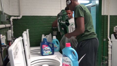Students pick out their favorite detergent in the new laundry room.