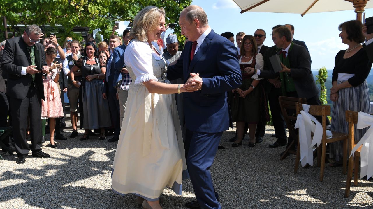 Austrian Foreign Minister Karin Kneissl and Russian President Vladimir Putin dance at her wedding.