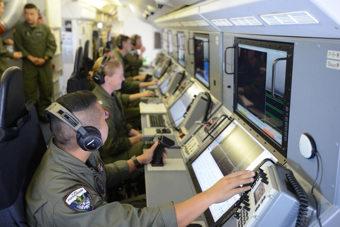 The five-person air combat crew aboard a US Navy P-8A monitor Chinese shipping and islands in the South China Sea on August 10, 2018.