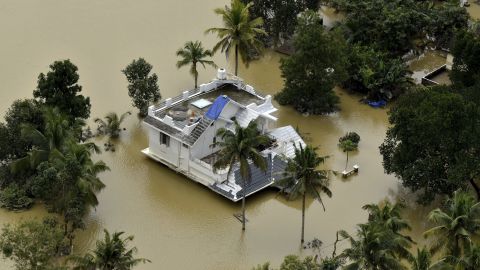 A house is partially submerged in flood waters in Chengannur in the southern state of Kerala, India, Sunday, August 19.