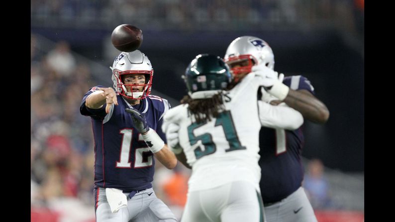 New England Patriots quarterback Tom Brady throws a touchdown pass to running back James White during a preseason NFL game against the Philadelphia Eagles on Thursday, August 16.