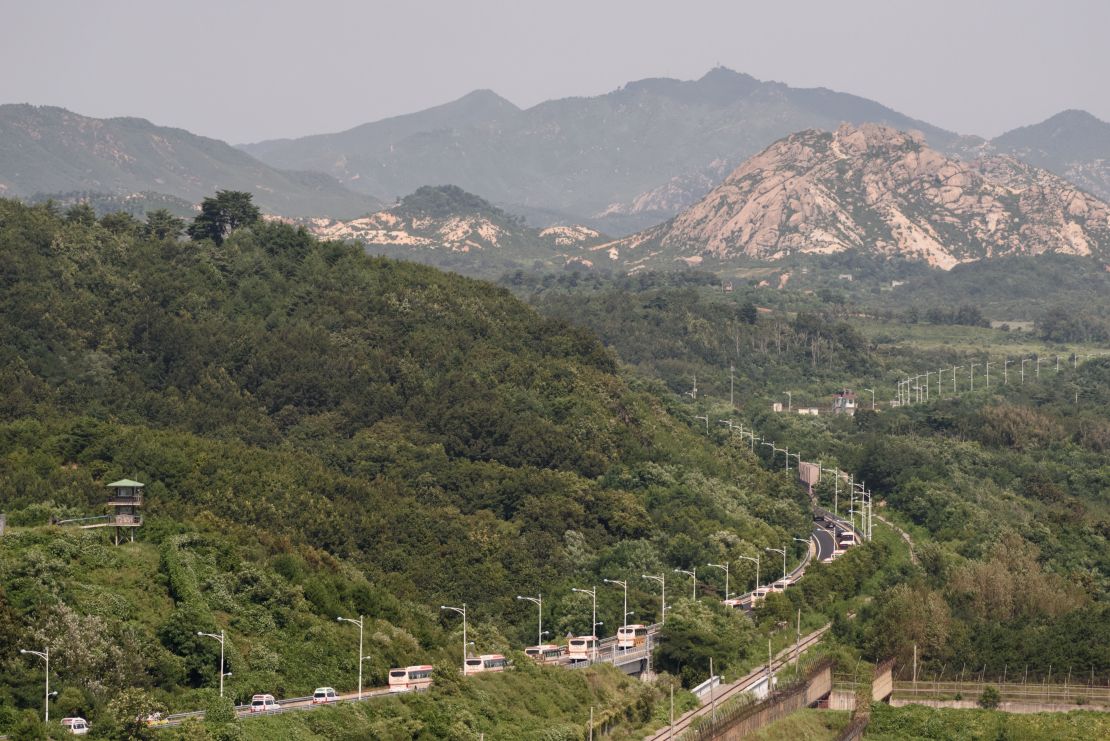 A convoy of buses carrying participants of an inter-Korean family reunion makes its way through the Demilitarized Zone (DMZ) towards North Korea.