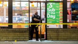 A police officer leaves a Subway after a person was shot Saturday, Aug. 18, 2018, in Chicago. (Tyler LaRiviere/Chicago Sun-Times via AP)