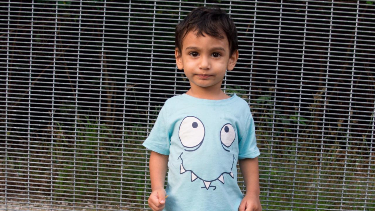 George likes to play with his toy car and he loves to write. He was born in Nauru -- the family have been on the island for 5 years.
