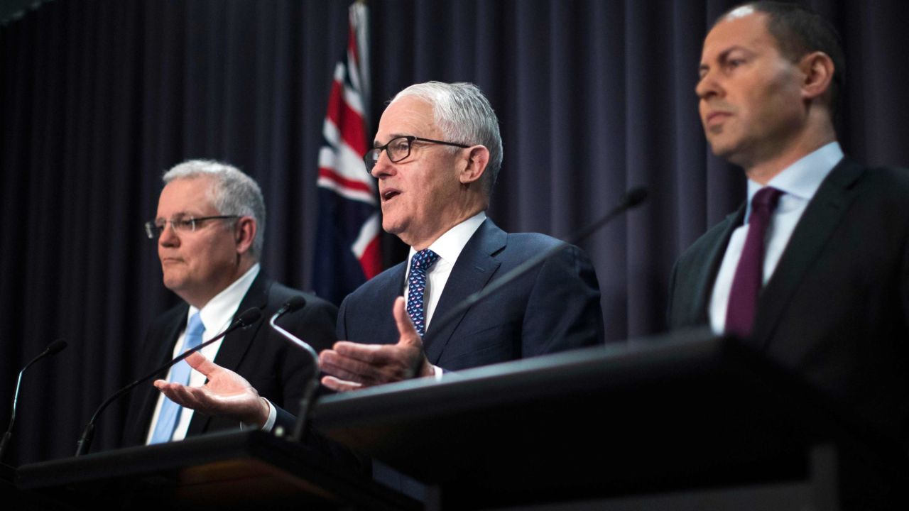 Malcolm Turnbull (center) speaks at a press conference with Treasurer Scott Morrison and Minister for Environment and Energy Josh Frydenberg on August 20.