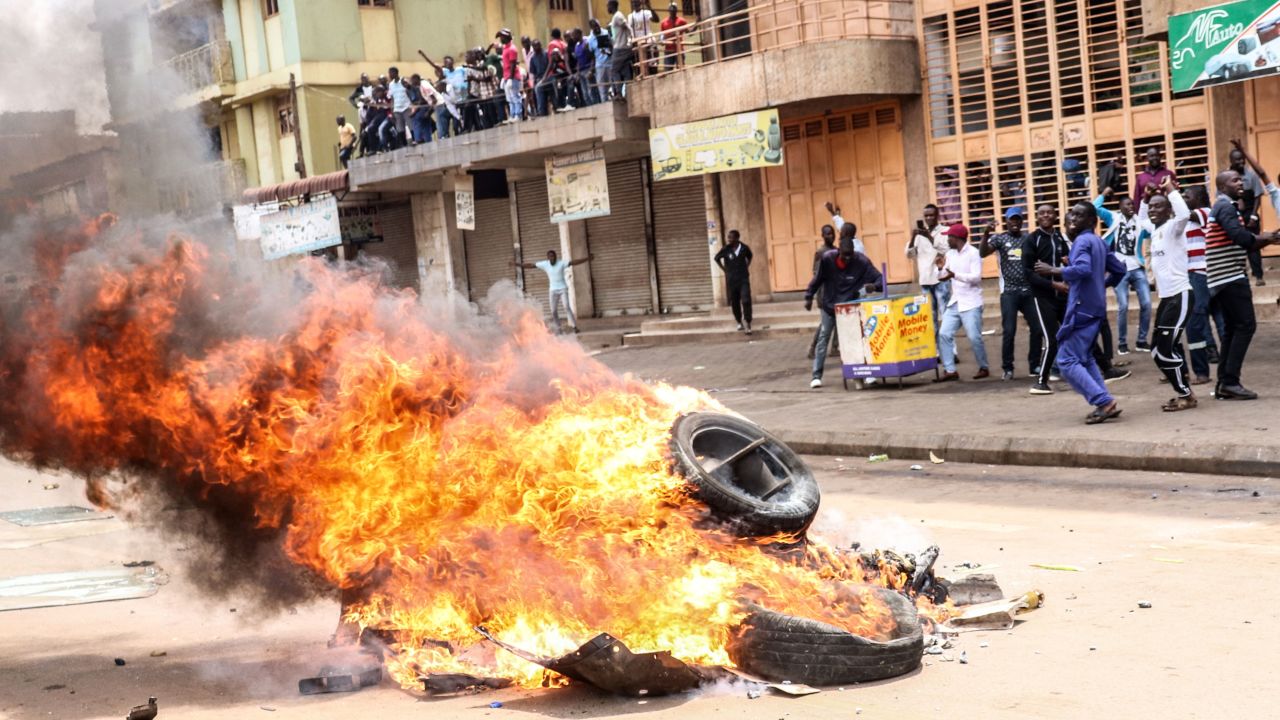 Protesters set a bonfire on a street to demand the release of the Ugandan politician Robert Kyagulanyi in Kampala, Uganda, on Monday.