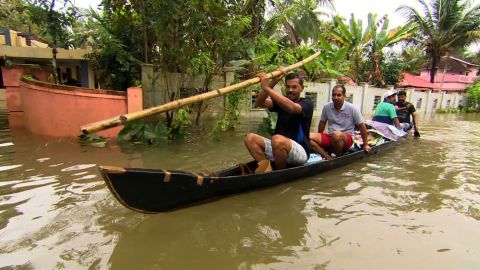Boats are used to rescue victims of the floodwaters.