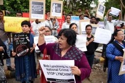 Indians protest against a series of mob lynchings that have been linked to viral hoax messages on WhatsApp 