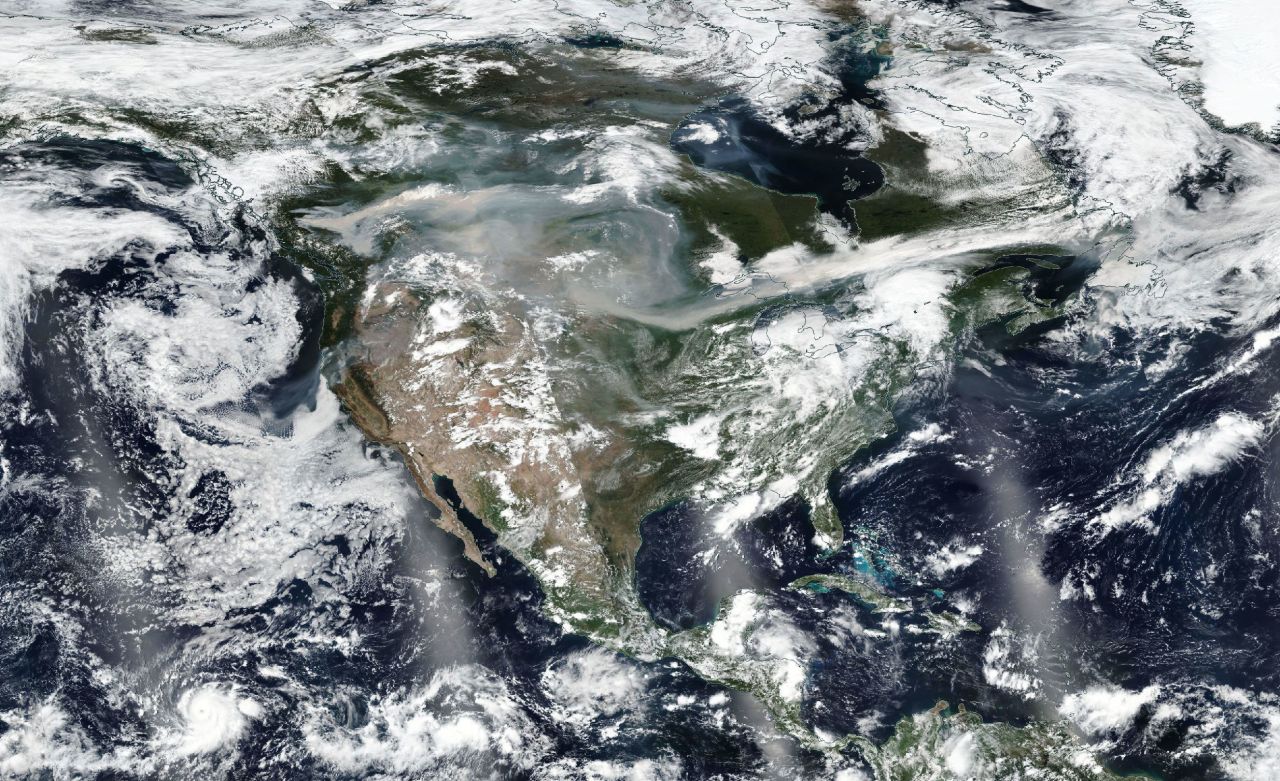 Satellite imagery shows Western wildfire smoke getting caught up in the jet stream and stretching from coast to coast on Friday, August 17.