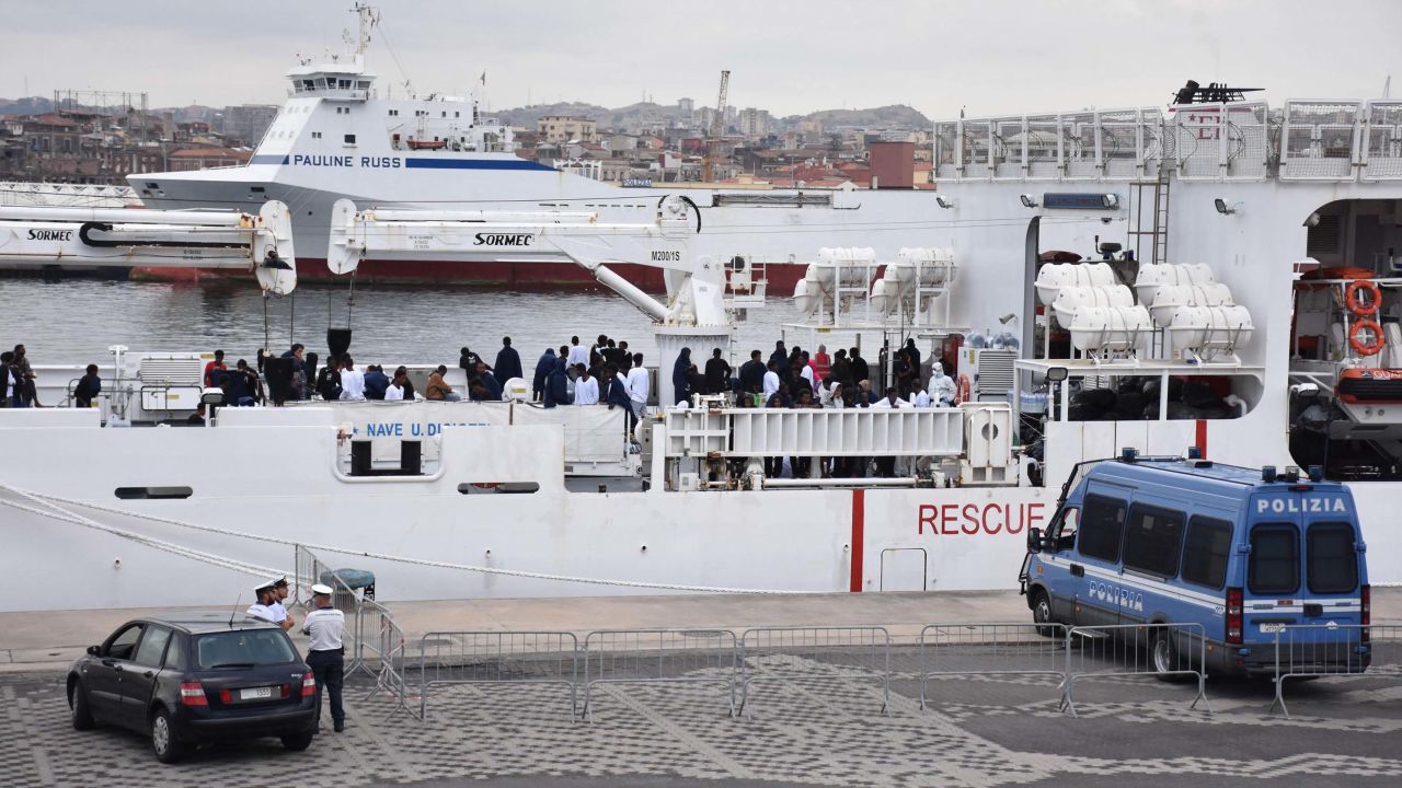 Migrants are seen on board the Italian Coast Guard ship Ubaldo Diciotti moored in the port of Catania in Sicily.