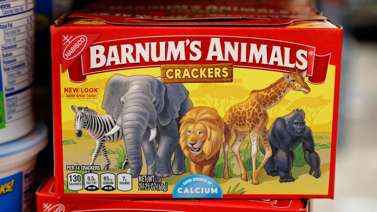 The redesigned Barnum's Animals crackers show a zebra, elephant, lion, giraffe and gorilla wandering side-by-side in a grassland.