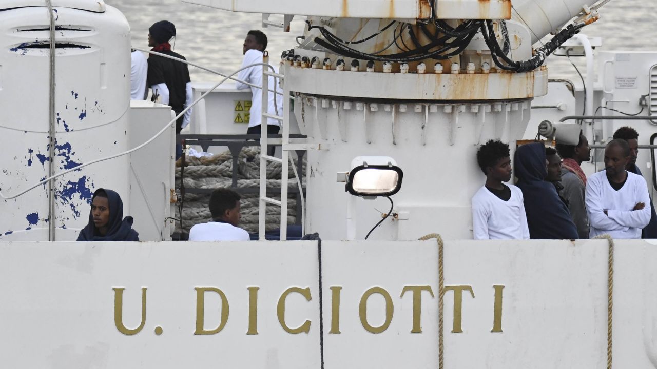 Migrants stand on the deck of the Ubaldo Diciotti, which has been docked in Catania, Sicily, since Monday.
