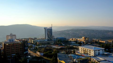 Kigali's expanding skyline. Rwanda has become more financially prosperous and stable under Kagame's leadership, but endemic poverty remains an issue nationwide, with around 51% of the population living under the international poverty line.