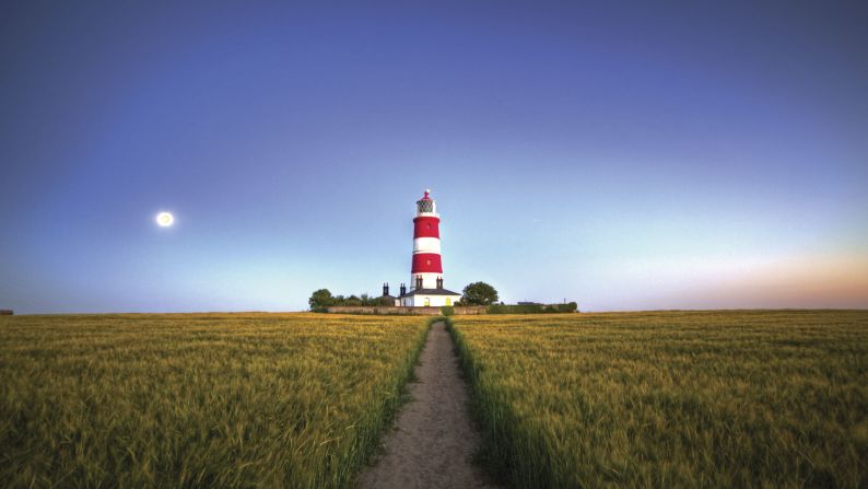 <strong>Wild and rocky: </strong>His favorite lighthouses that he's visited are in Brittany, France: "The coast is very wild and rocky, mostly made up of granite, and the lighthouses are built of exactly the same material, great strong granite towers that just seemed to rise out of the rock," says Ross. <em>Pictured here: Happisburgh Lighthouse, Norfolk, England</em>