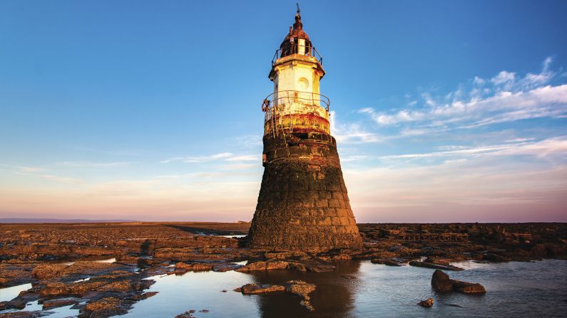 <strong>Old meets new: </strong>In Ross' new book, he helps tell the story of 150 lighthouses -- from rugged, old structures to modern new designs. <em>Pictured here: Plover Scar Lighthouse, Cockerham Sands, Morecambe Bay, England</em>