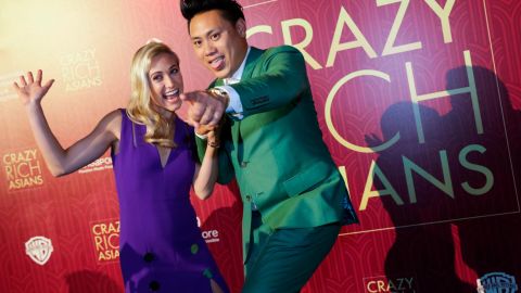 Director John Chu and his wife Kristin Hodge pose as they arrive for the red carpet screening of the movie "Crazy Rich Asians" on Tuesday, Aug. 21, 2018.
