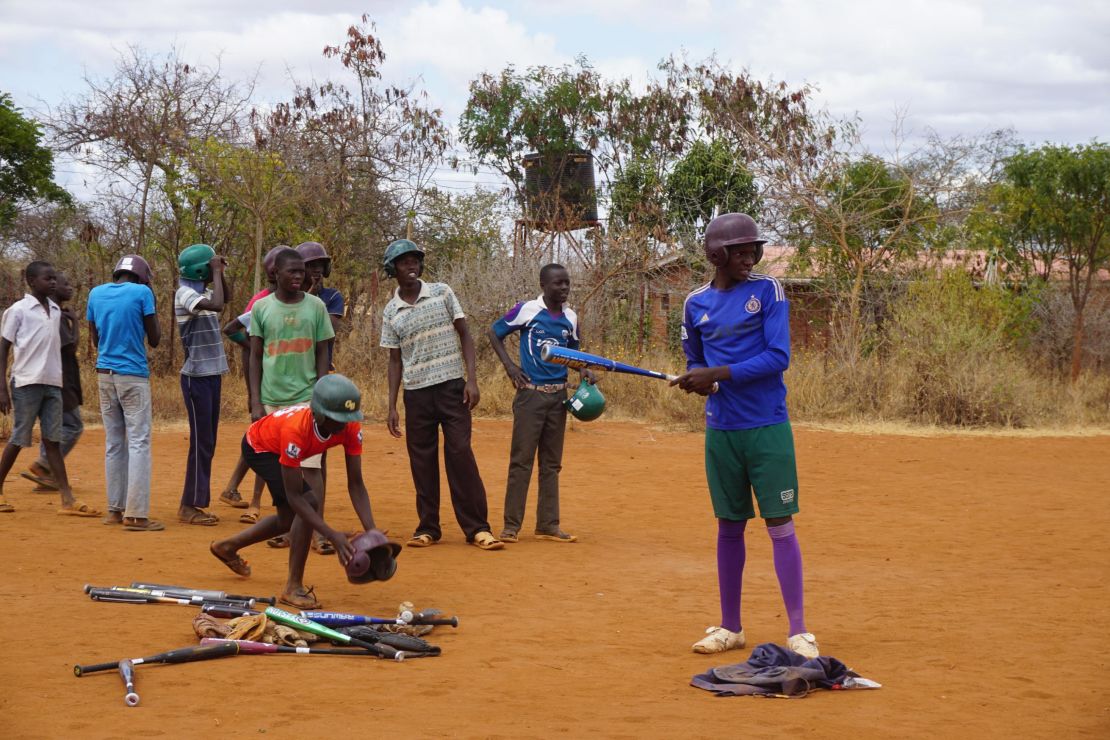 Kenyans watch a game of baseball