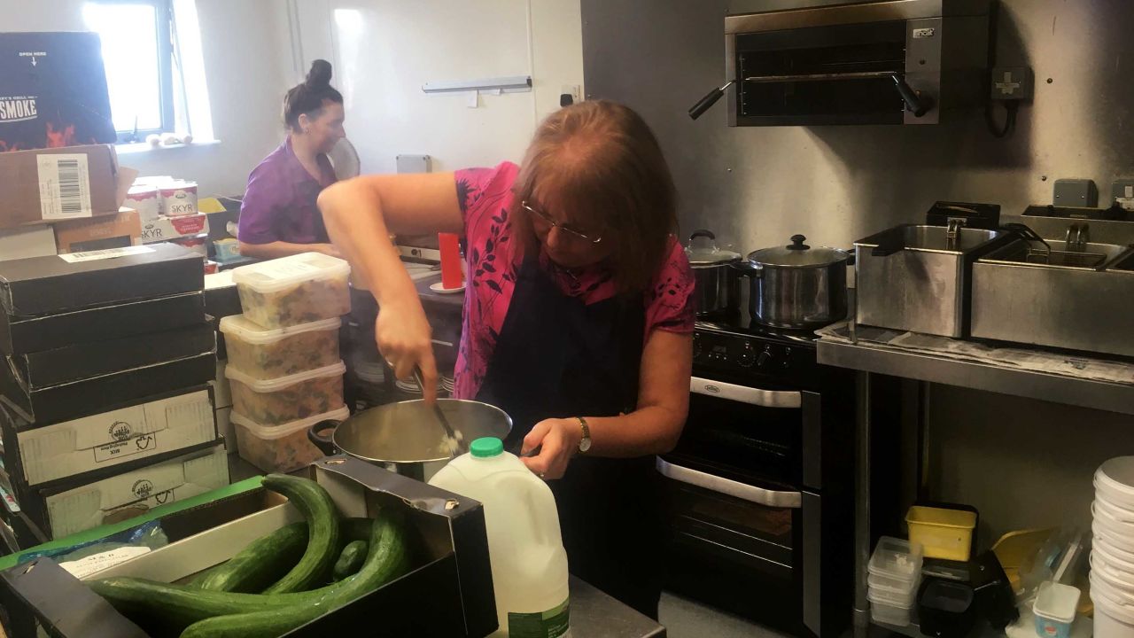 Dianne Williams mashes potato in preparation for lunchtime.
