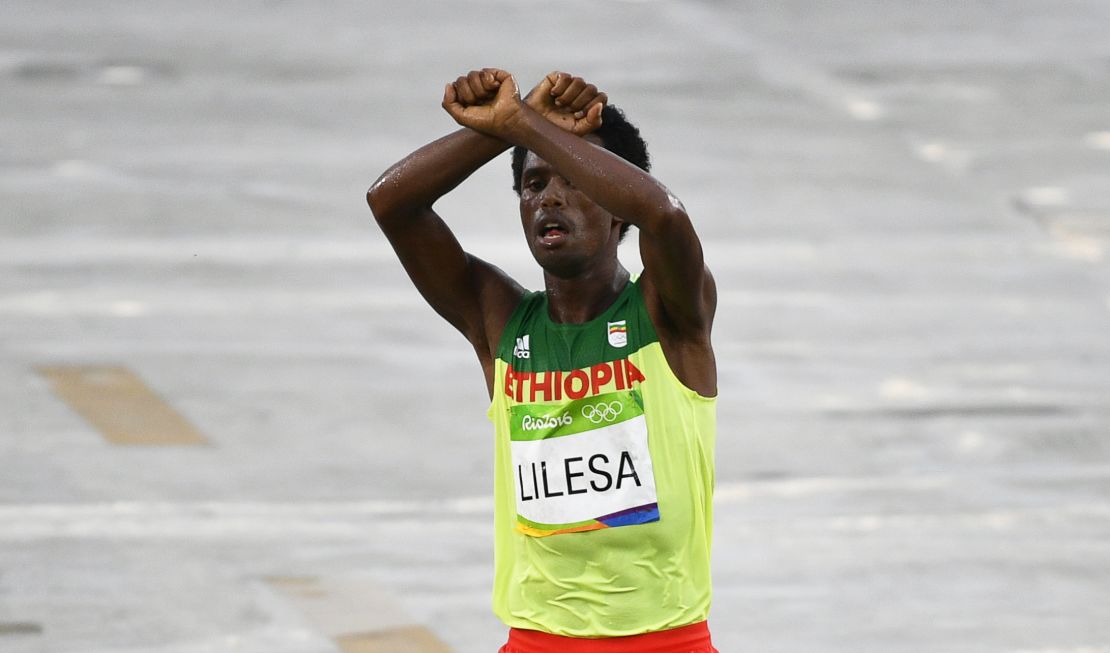 Feyisa Lilesa protests as he takes second place in the men's marathon race at the Rio 2016 Olympic Games.