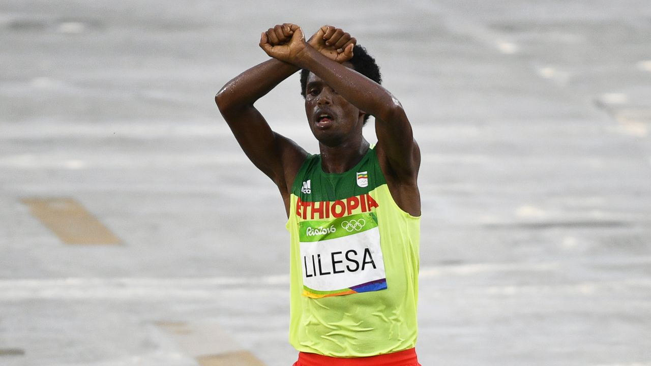 Feyisa Lilesa protests as he takes second place in the men's marathon race at the Rio 2016 Olympic Games.
