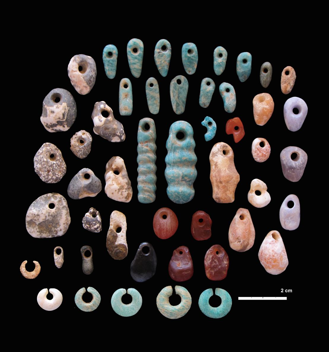 Stone pendants and earrings from the communal cemetery of Lothagam North, Kenya. 
