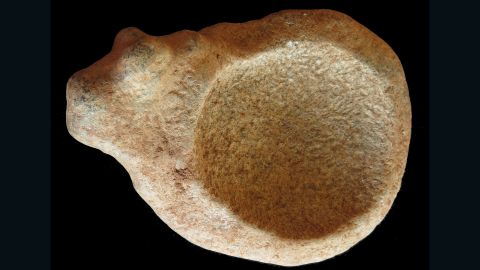Stone palette with zoomorphic bovine carving from the communal cemetery of Lothagam North, Kenya.