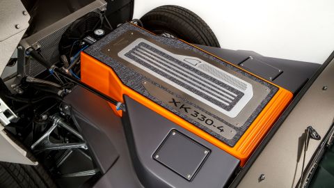 The battery fits where the 6-cylinder engine originally was.