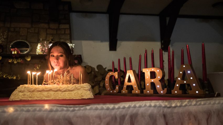 Cara Pressman blows out the candles on her cake as she attends her sweet 16 birthday party with family and friends at Nyack Beach State Park in Nyack, New York, Saturday August 18, 2018. Cara recently underwent laser ablation brain surgery for seizures she has suffered nearly all her life, a less invasive procedure that was initially denied by her insurance carrier Aetna, but later approved.
Photograph: Victor J. Blue