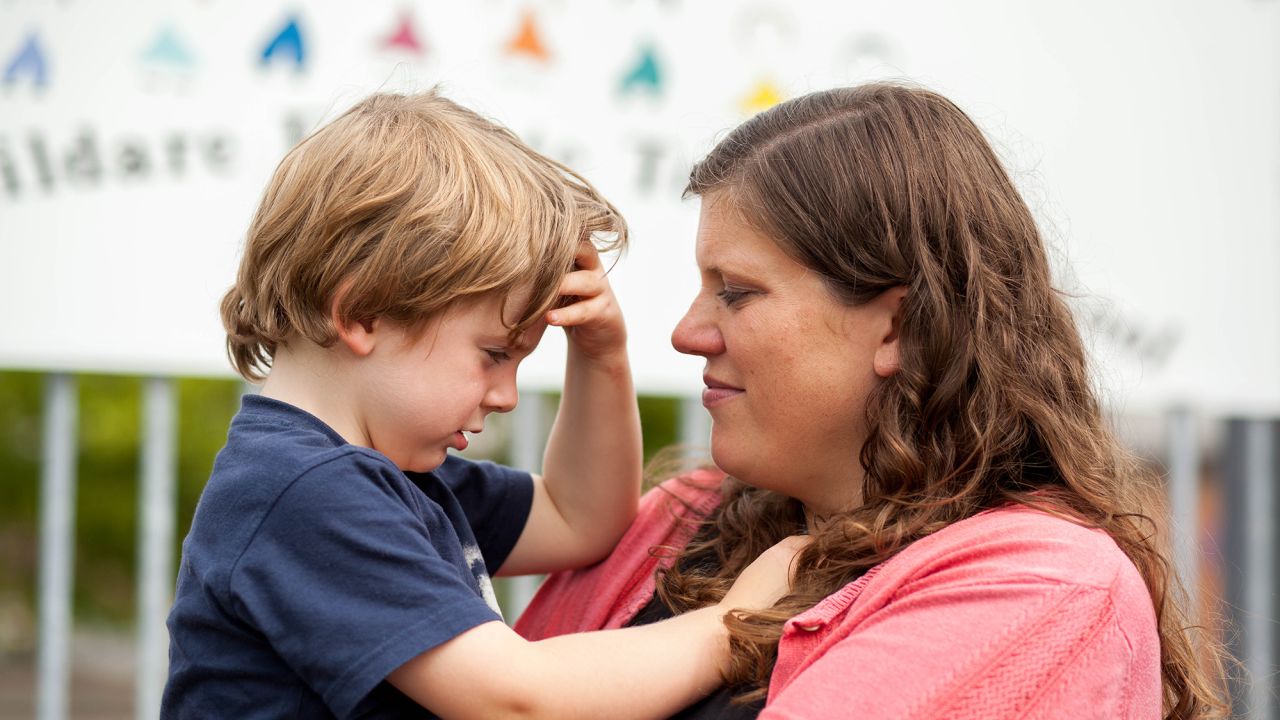 Matthews and her son Faolán outside the North Kildare Educate Together school, a 15-minute drive from their house. Matthews placed her son on its waitlist in March 2015, hoping for a spot by September 2019. Now she is campaigning for another secular school to open in her locality.