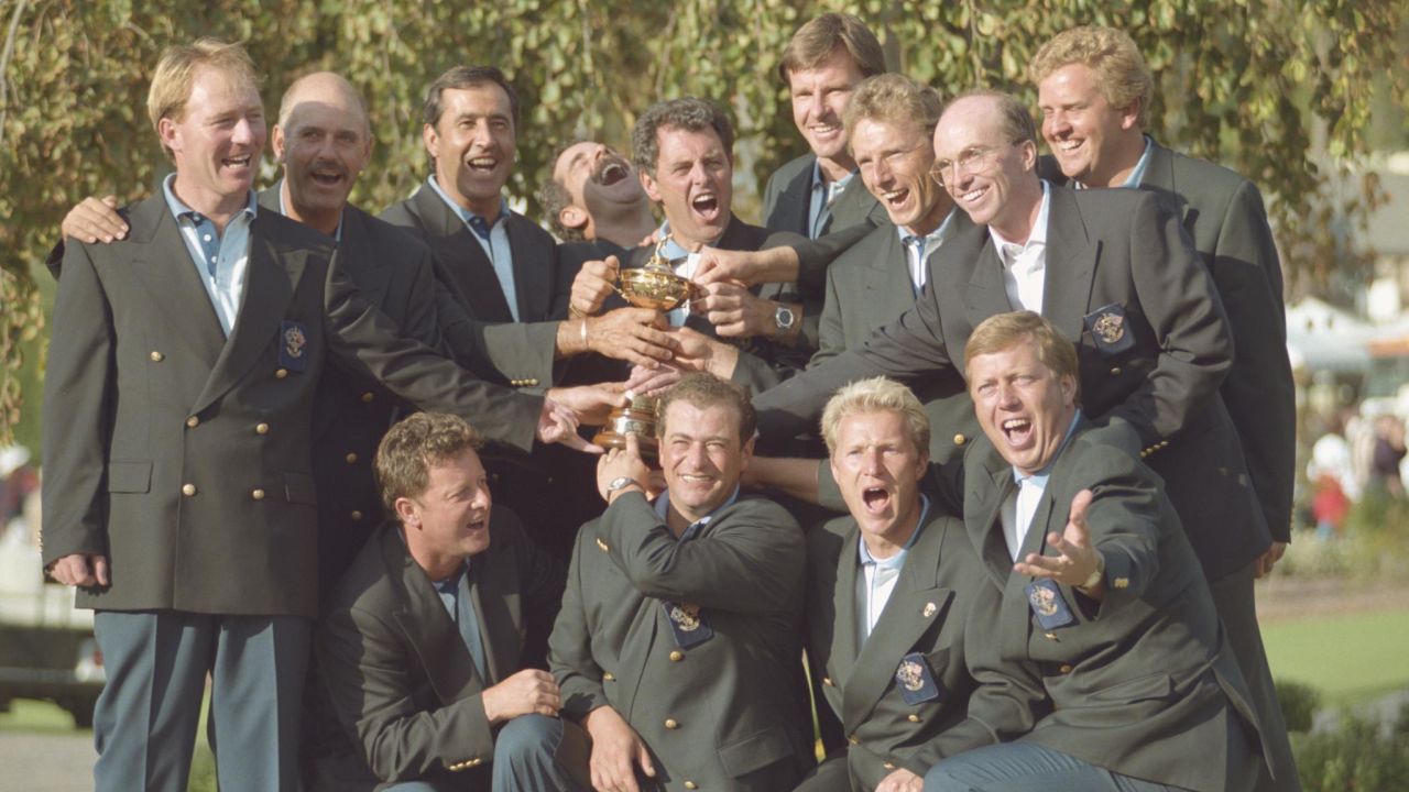 The victorious Europe team pose together for a group photograph with the Ryder Cup trophy, Back Row L-R: Philip Walton, Mark James, Severiano Ballesteros, Sam Torrance, Bernard Gallacher (captain), Nick Faldo, Bernhard Langer, David Gilford, Colin Montgomerie, Front Row L-R: Ian Woosnam, Costantino Rocca, Per-Ulrik Johansson, and Howard Clark during the 31st Ryder Cup Matches on 24 September 1995 at the Oak Hill Country Club in Pittsford, New York. (Photo by J.D.Cuban/Getty Images)