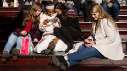 NEW YORK, NY - DECEMBER 01: A group of teens look at a photograph they took on a smartphone in Times Square, December 1, 2017 in New York City.  The photo-sharing app Instagram has released data for its most-Instagrammed cities and locations for 2017. New York City is ranked number one, with Moscow and London coming in second and third. Among the most photographed locations in New York City were the Brooklyn Bridge, Times Square and Central Park. (Photo by Drew Angerer/Getty Images)