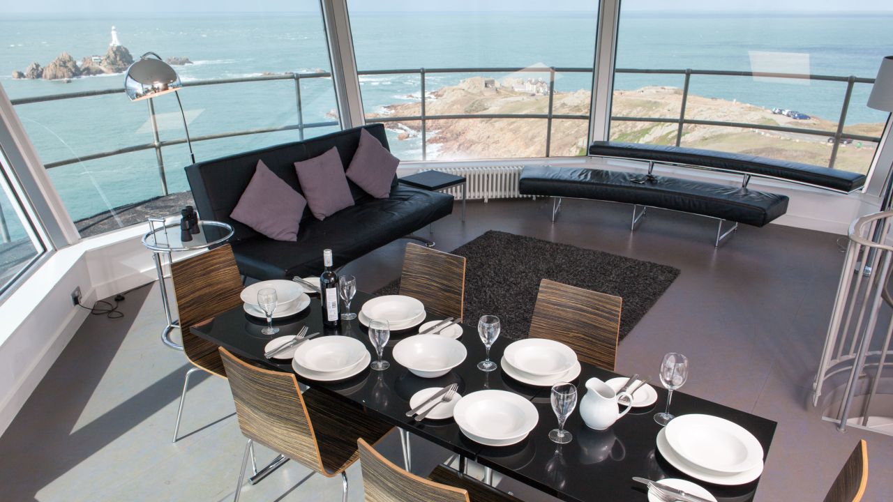 There is a dining area for eating with a view.