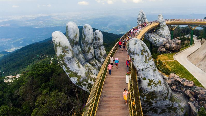<strong>Ba Na Hills, Vietnam: </strong>The 150-meter-long <a href="index.php?page=&url=https%3A%2F%2Fcnn.com%2Fstyle%2Farticle%2Fgiant-hands-cradle-vietnam-bridge%2Findex.html">Golden Bridge</a> rises above Trường Sơn Mountains. It's supported by a pair of giant hands which may look weathered, but the bridge opened only in June 2018. 