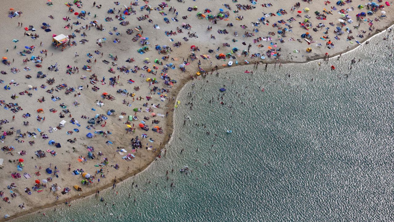 <strong>Haltern, Germany:</strong> An aerial view of a beach on the shores of Lake Silbersee shows beach-goers enjoying the early August heatwave. <br />