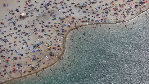 <strong>Haltern, Germany:</strong> An aerial view of a beach on the shores of Lake Silbersee shows beach-goers enjoying the early August heatwave. <br />